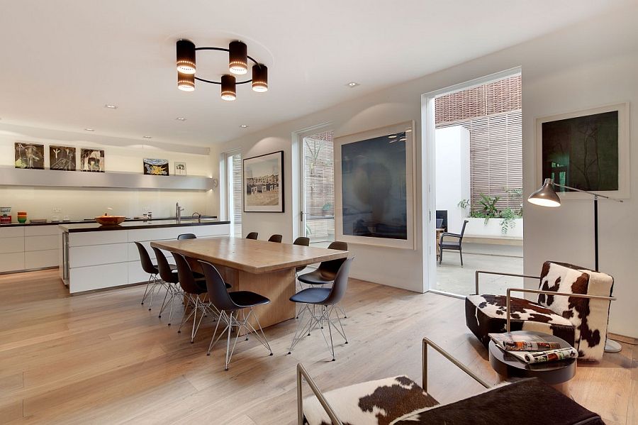 Dining area and kitchen that is connected visually with the spaces outside