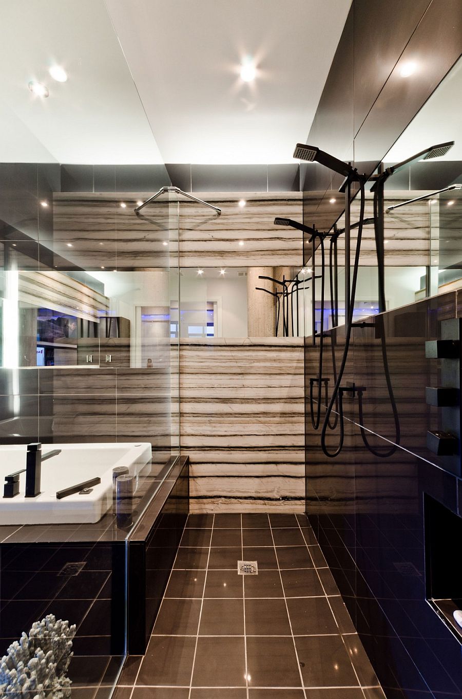 Exquisite use of glass gives the small bathroom a spacious appeal