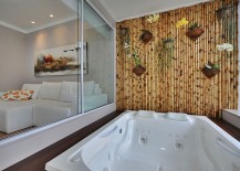 Fabulous-bamboo-wall-acts-as-the-perfect-backdrop-for-a-tranquil-soothing-dip-217x155