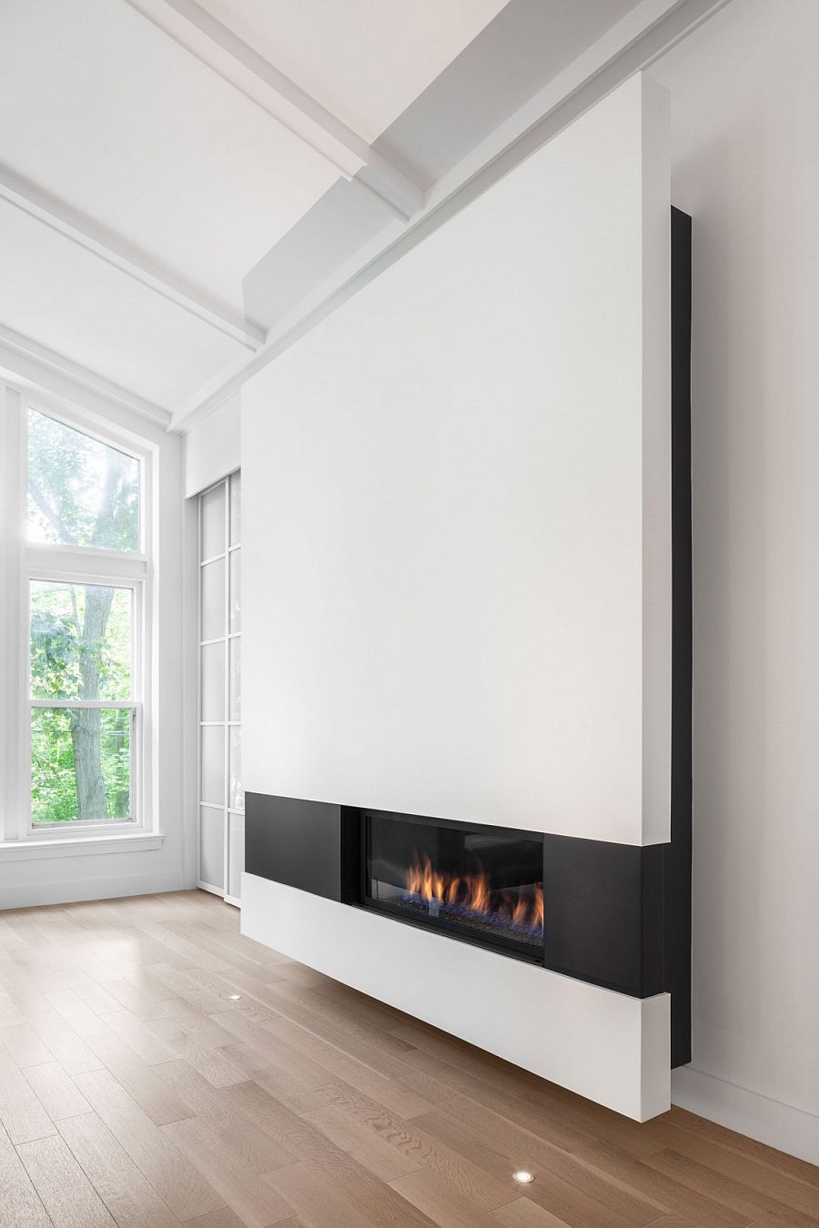 Fabulous, sleek fireplace adds to the appeal of the contemporary addition
