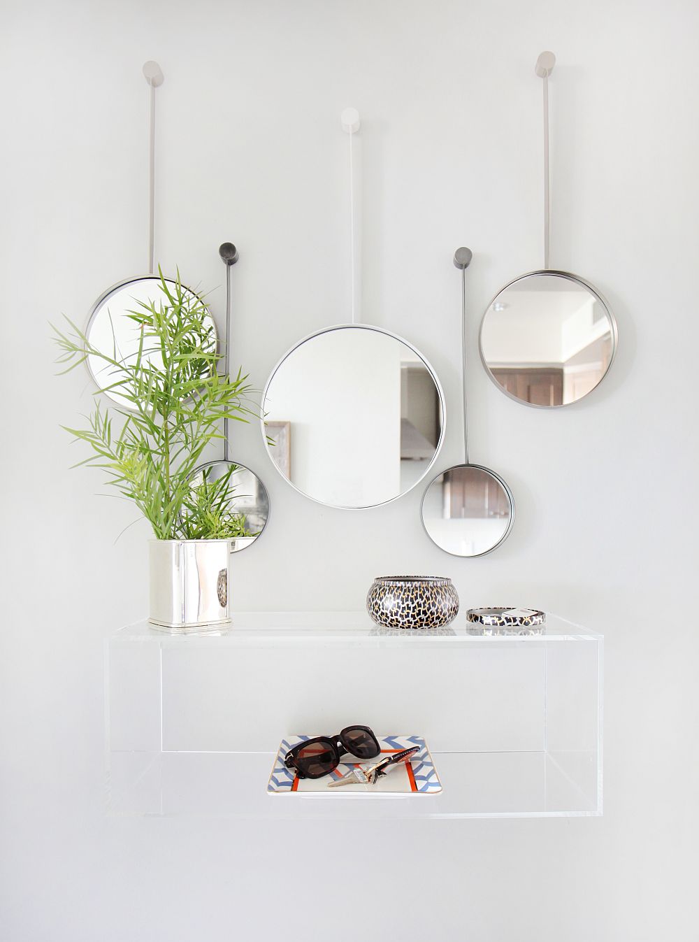 Floating acrylic vanity and mirrors in the modern home