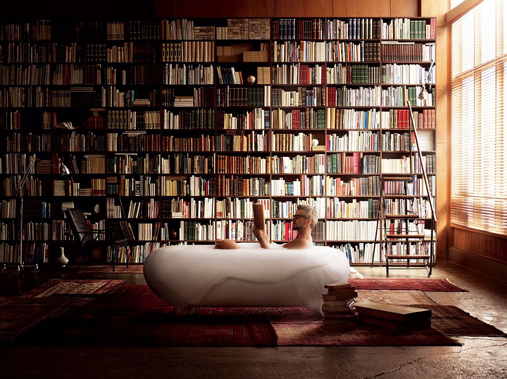 Foam spa in the bathroom along with an imposing shelf full of books [Design: Kenya Hara]