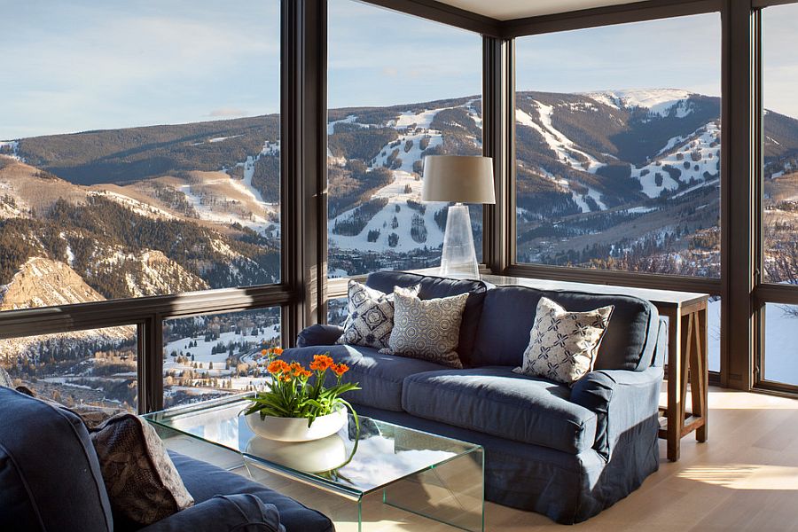 Glass walls open up the living room to the view outside