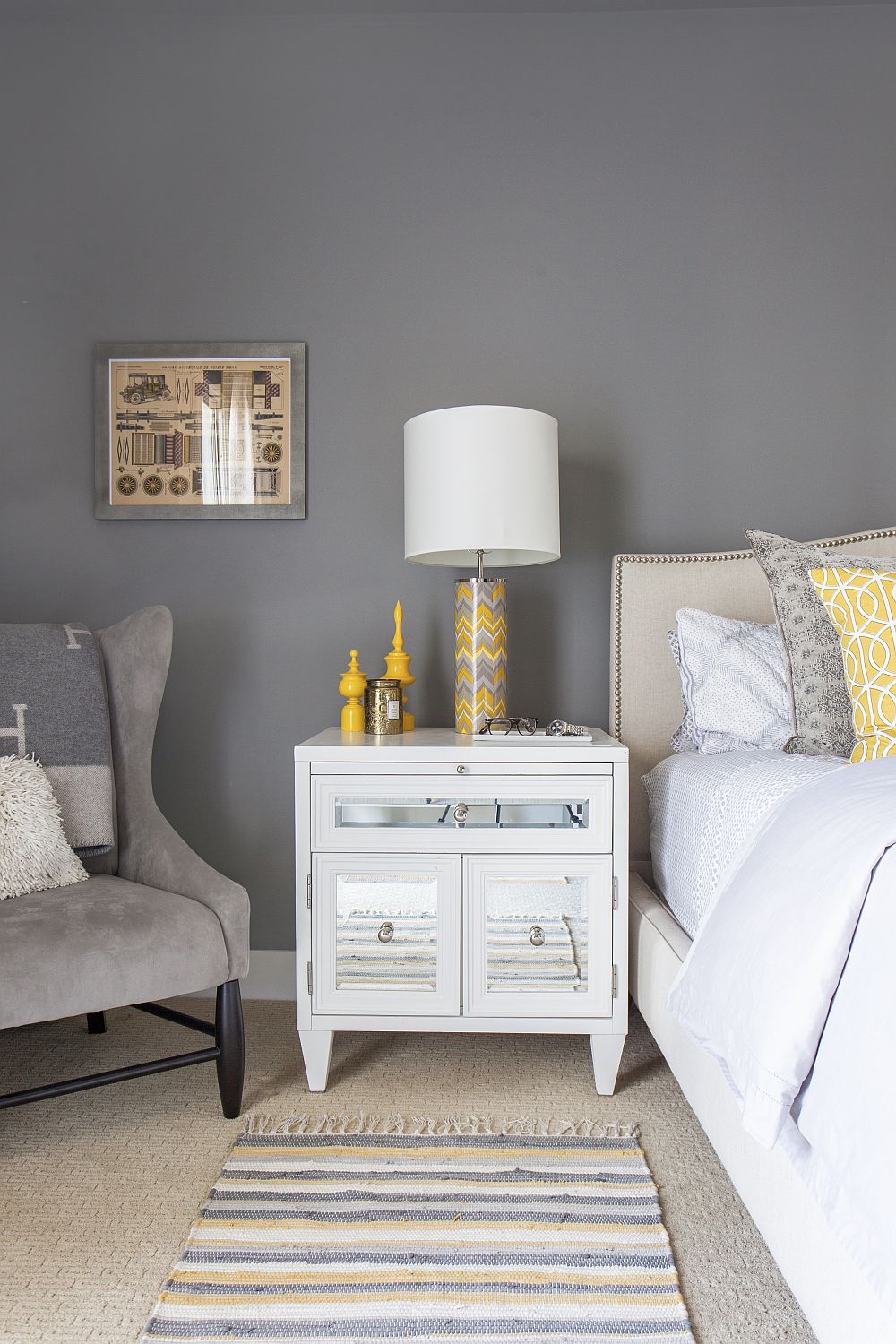 Gray bedroom with simple yellow accents