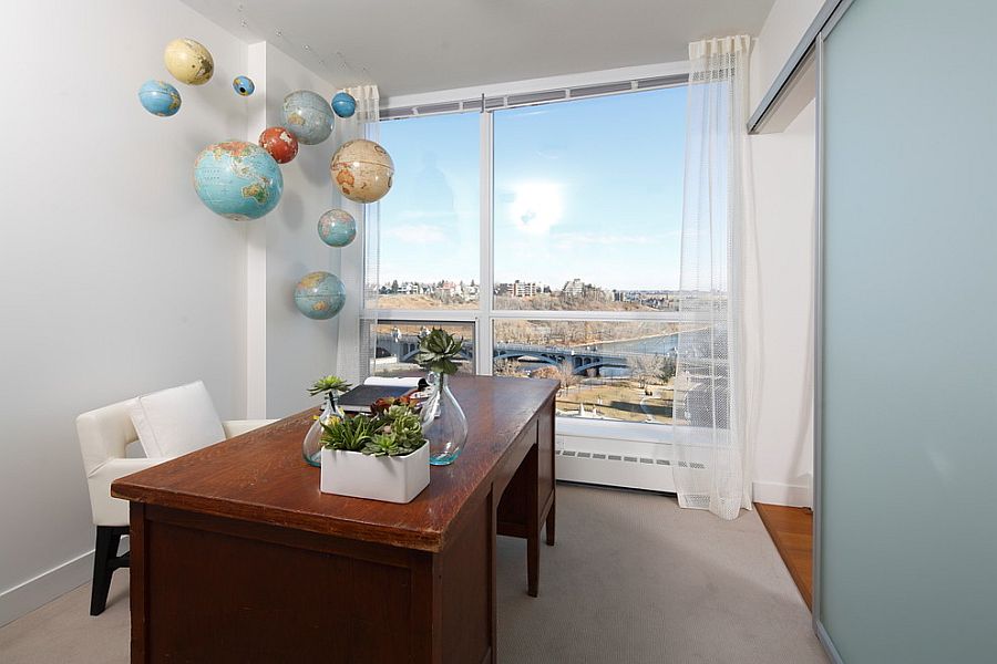 Hanging globes in the home office make a quirky addition [Design: i3 design group]