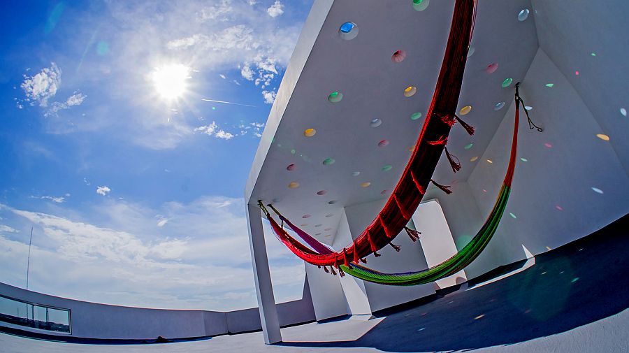 Holes in the roof mimic the shape and hues of pumpos