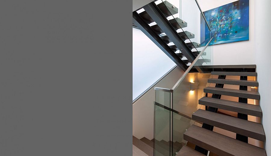 Lovely staircase connects various levels of the house and the garage