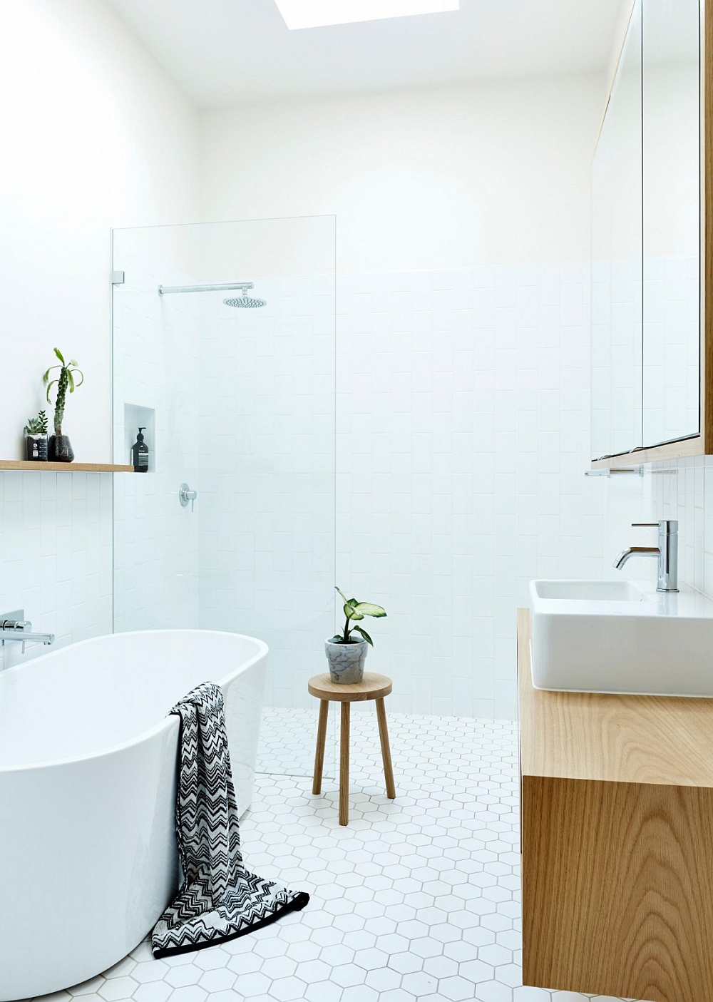 Luxurious bathroom in white with standalone bathtub