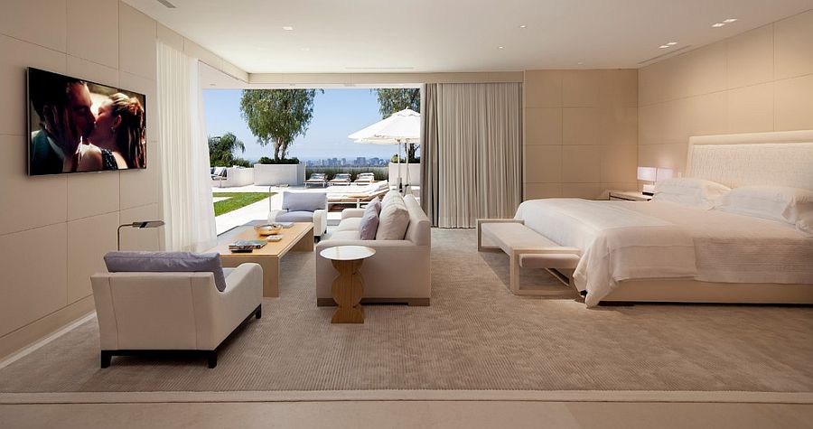 Luxurious contemporary bedroom that opens up towrads the private deck