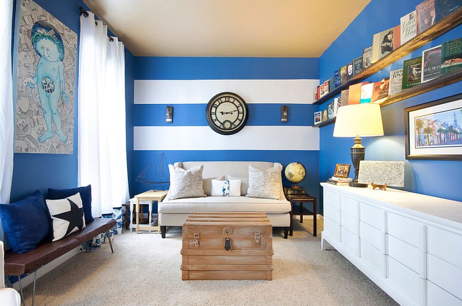 Narrow living room with a striped accent wall [Photography: Matthew Bolt Graphic Design]