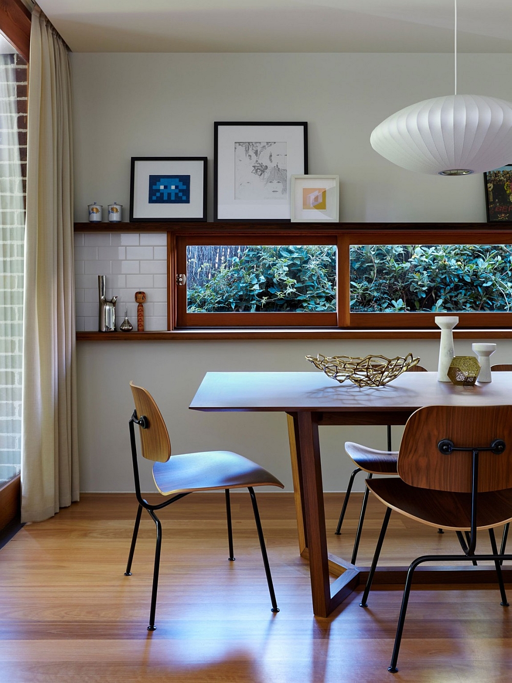 Narrow window in the dining room brings the garden charm indoors