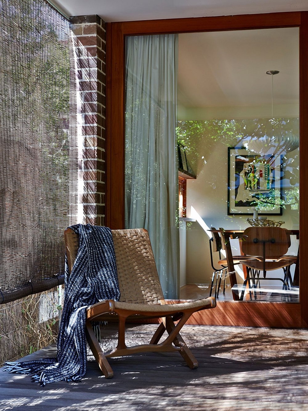 Shaded porch that is visually connected with the living room