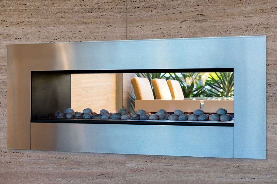 Sleek contemporary fireplace serves both the living room and dining space