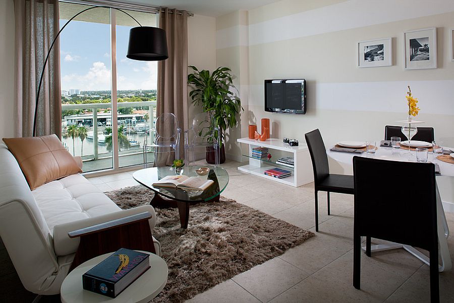 Small living area and dining space with a striped accent wall