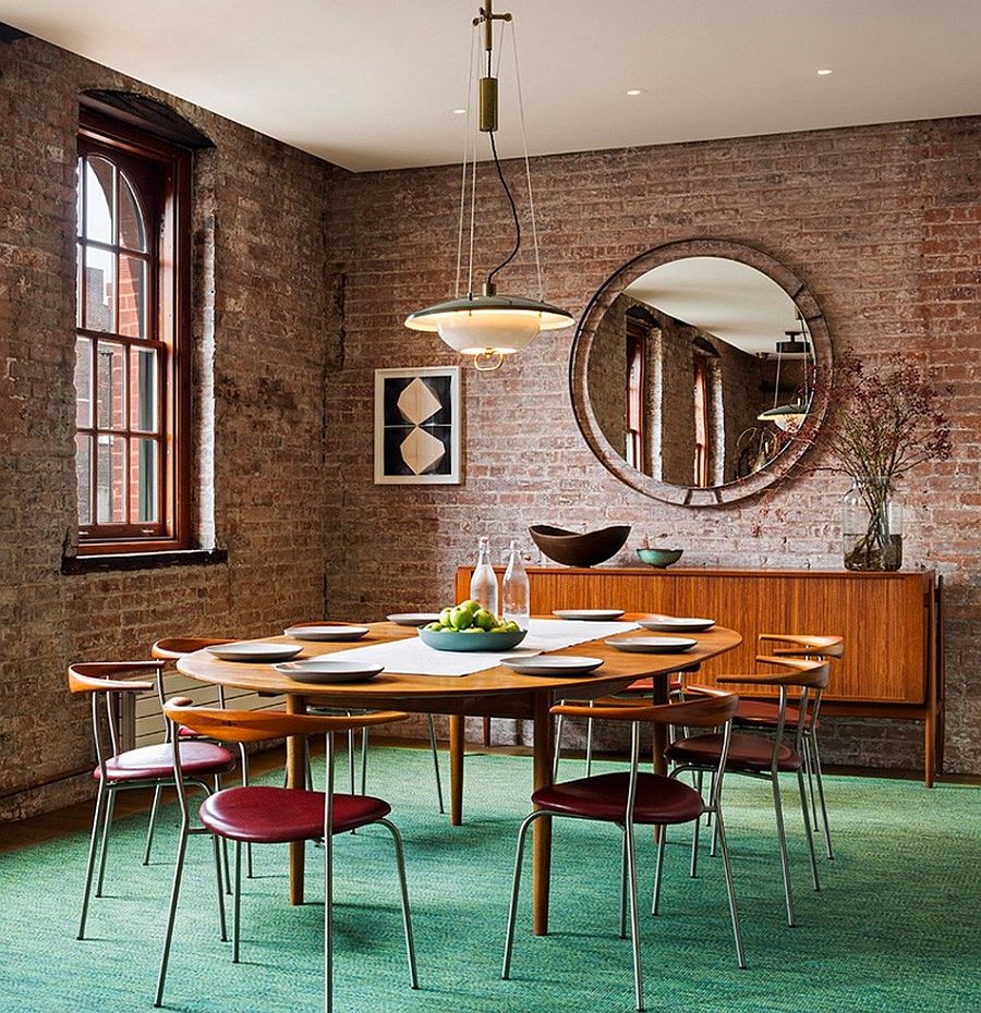 Vintage funiture and a brick wall backdrop shape the unique dining space