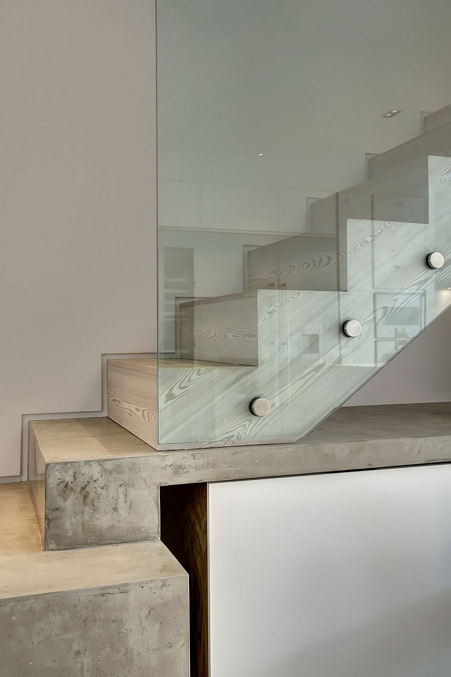 Wooden staircase with glass railing