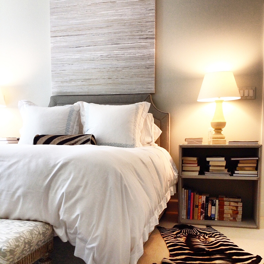 Zebra rugs and pillows add texture and pattern to the bedroom