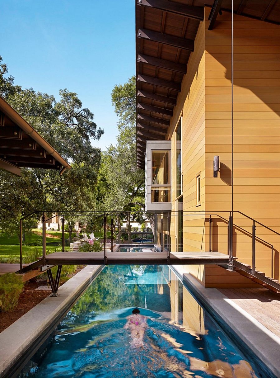 lap pool design with a walkway above it