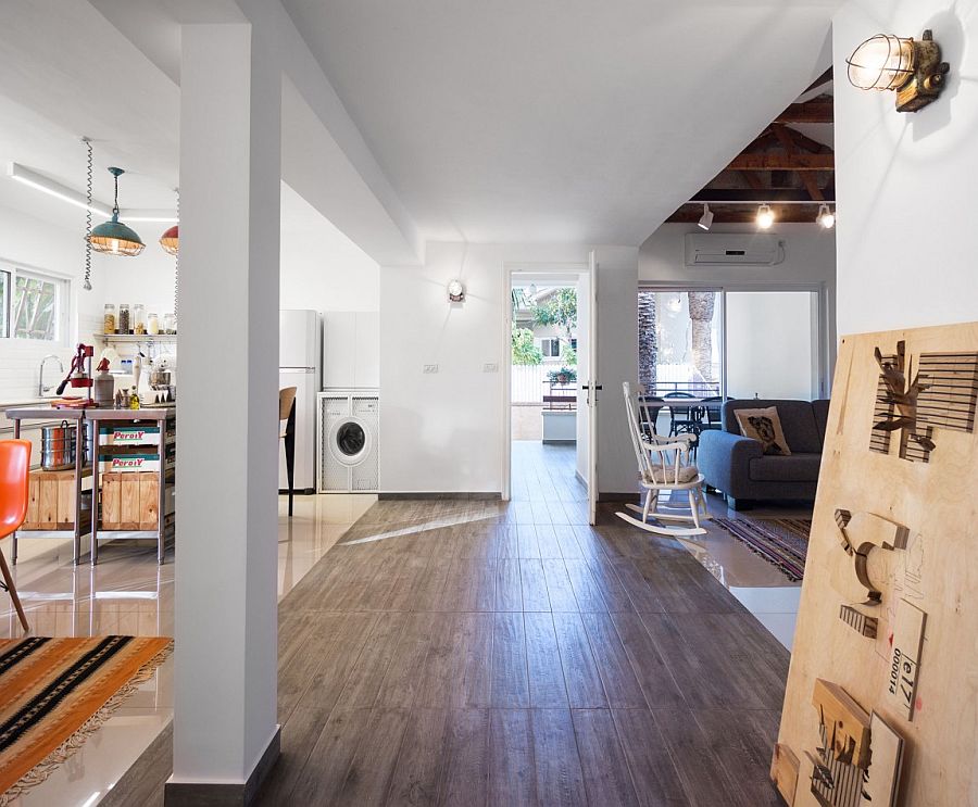 A change in flooring helps demarcate spaces in an open floor plan