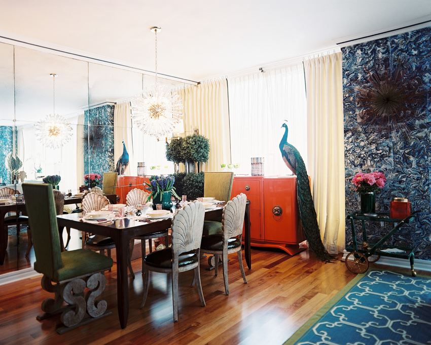 A mirrored wall opens up an elegant dining room