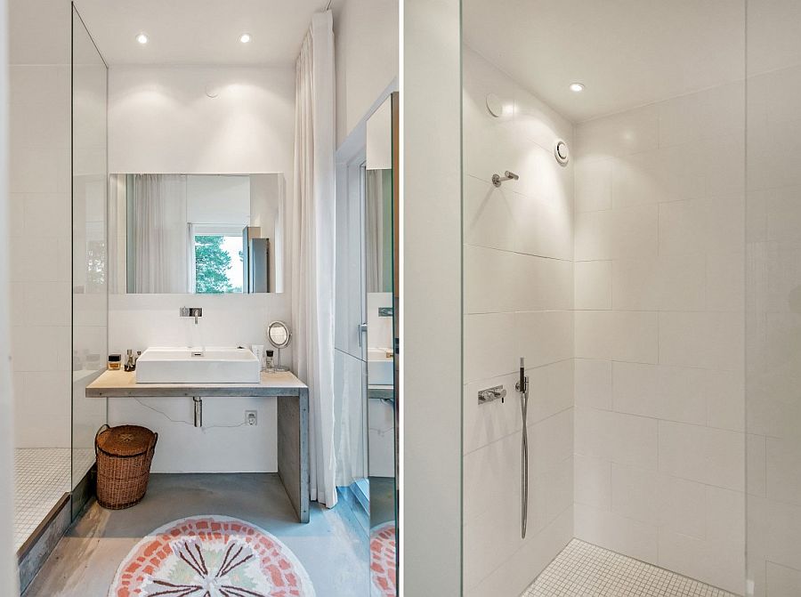 Bathroom in white leads way towards the private gardens