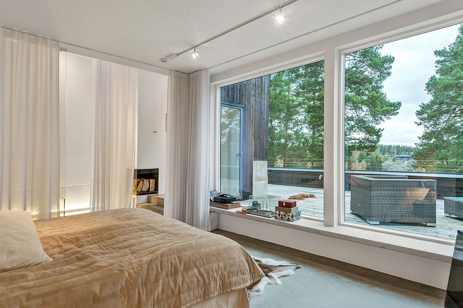 Bedroom with private deck that offers a view of the landscape