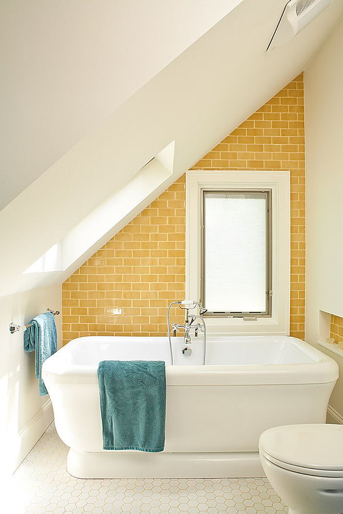 Bright yellow accent wall for the small attic bathroom in white