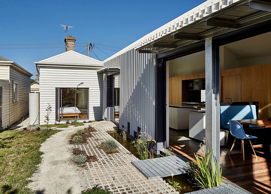 Central space of the house with garden features a deliberate incomplete look