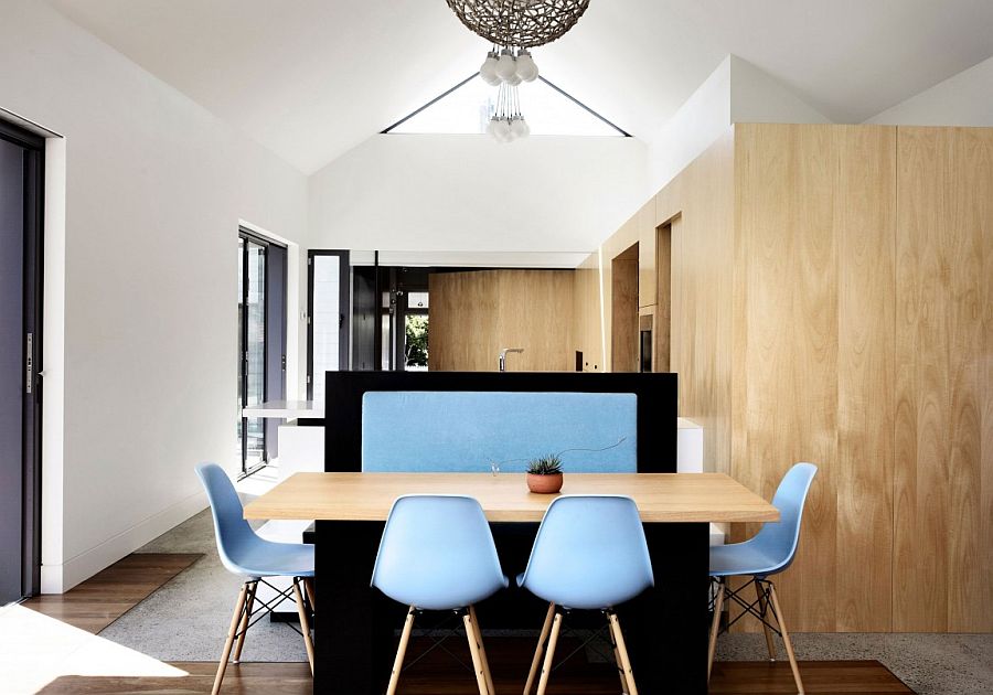 Classic Eames chairs add a touch of blue to the interior