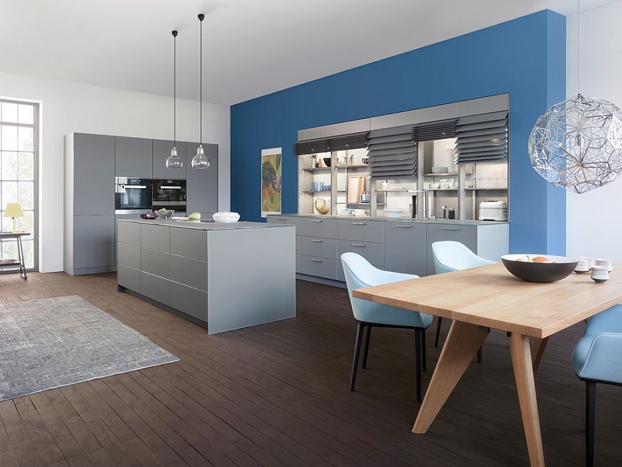 Contemporary kitchen composition with sleek gray shelves and a blue backdrop