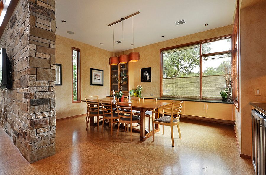 Cool pendant adds to the warm color scheme of the dining room