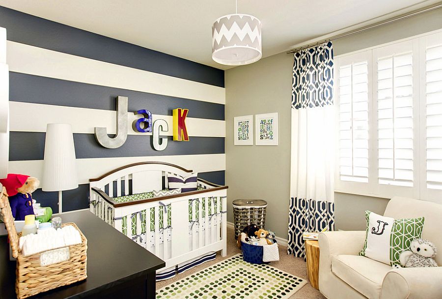 Curtains bring additional color and pattern to the stylish nursery [Design: J & J Design Group]