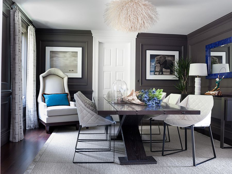 Dark gray walls and royal blue accents in the classy dining room [Design: Green Couch Interior Design]