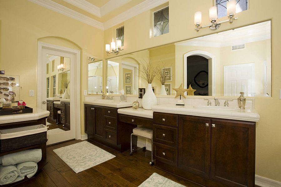 Dark walnut vanity adds to the warmth of the bathroom [Design: Savvy Interiors]