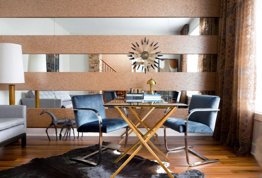 dining room with mirrored wall