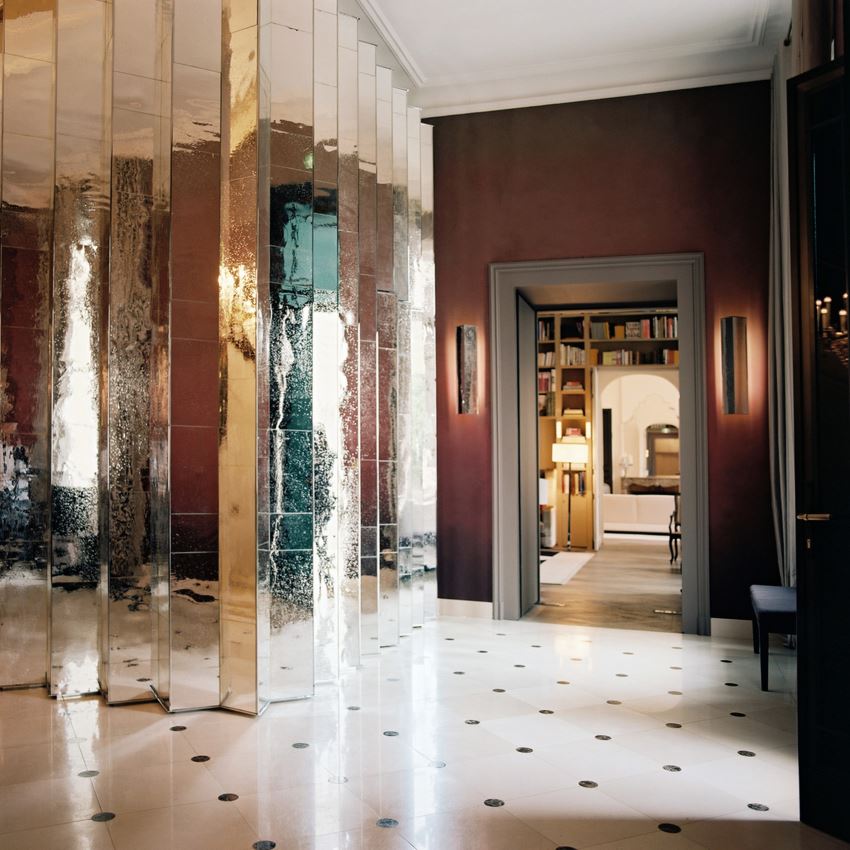 Elegant entryway with a pleated mirror wall