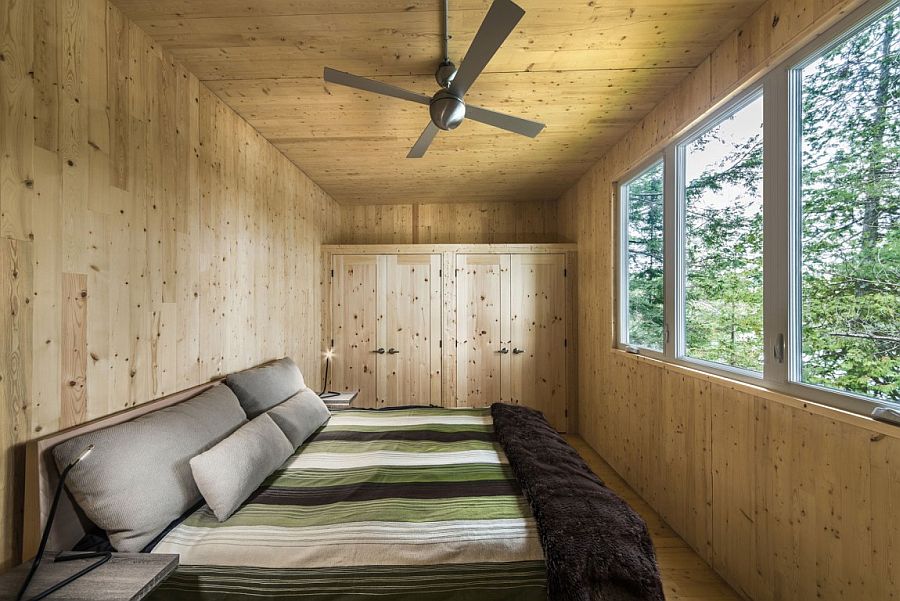 Fabulous bedroom of the cottage has a rustic vibe