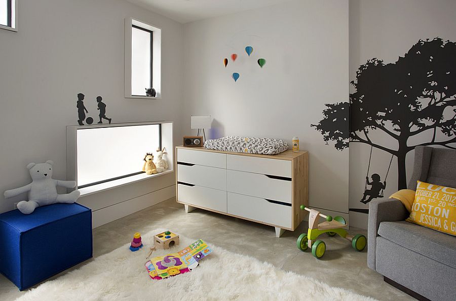 Framed windows and a cool color scheme shape the trendy nursery