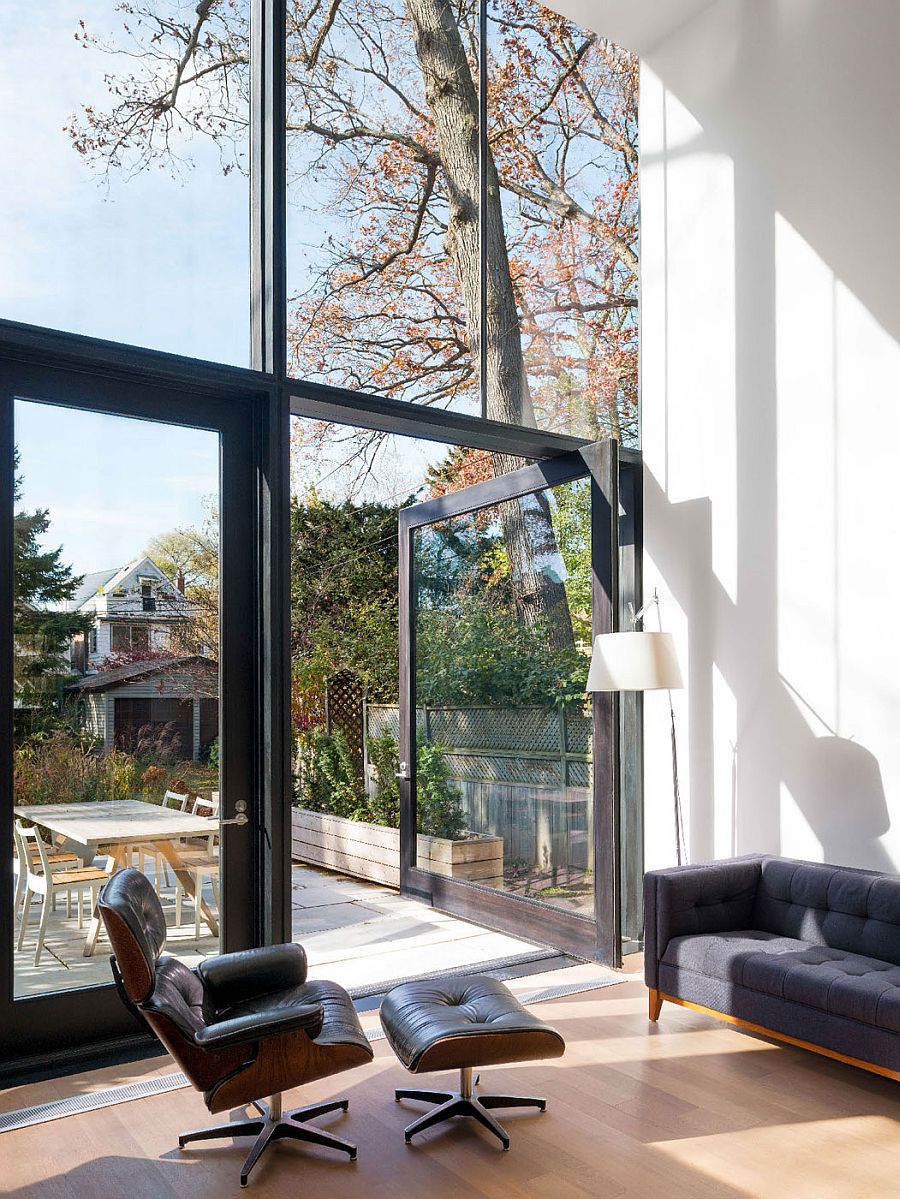 Large framed glass doors connect the interior with the backyard