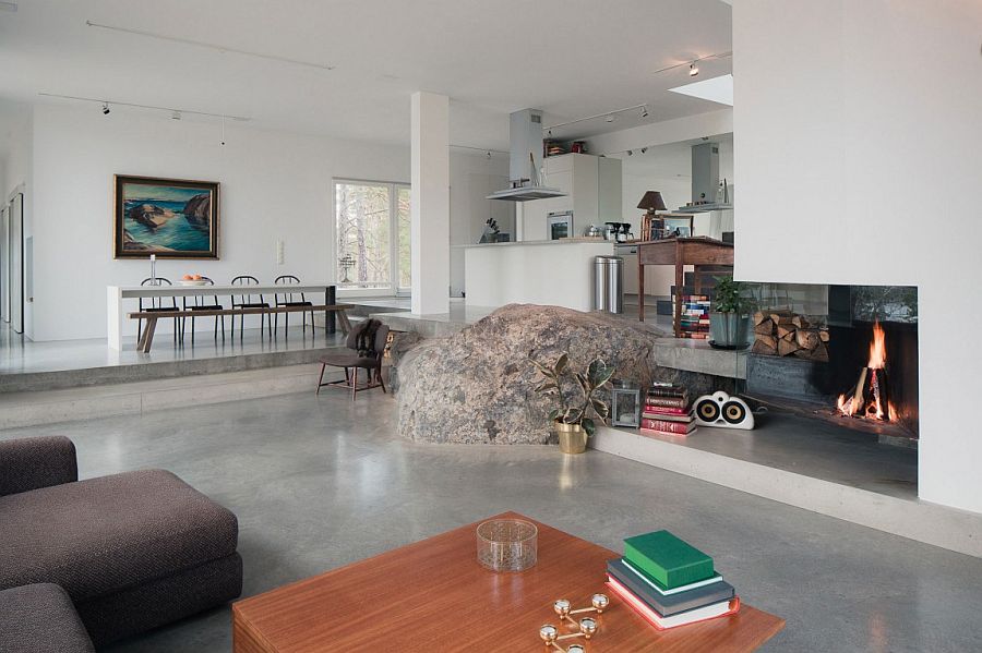 Large natural rock in the middle of the contemporary living area