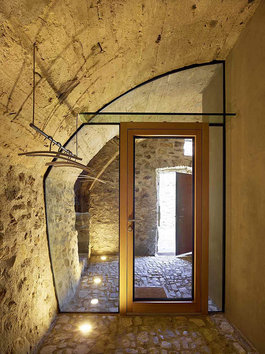 Lighting brings cozy warmth to the renovated stone house