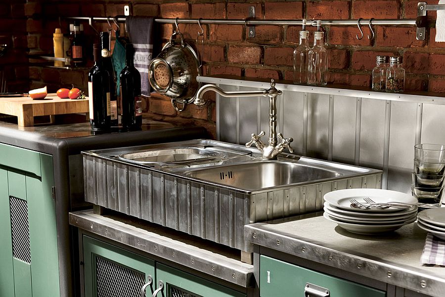 Lovely metal backsplash and brick walls in the vintage kitchen