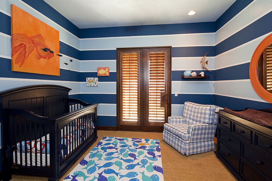 Lovely use of stripes and pops of orange in the cool nursery [Design: Bravo Interior Design]