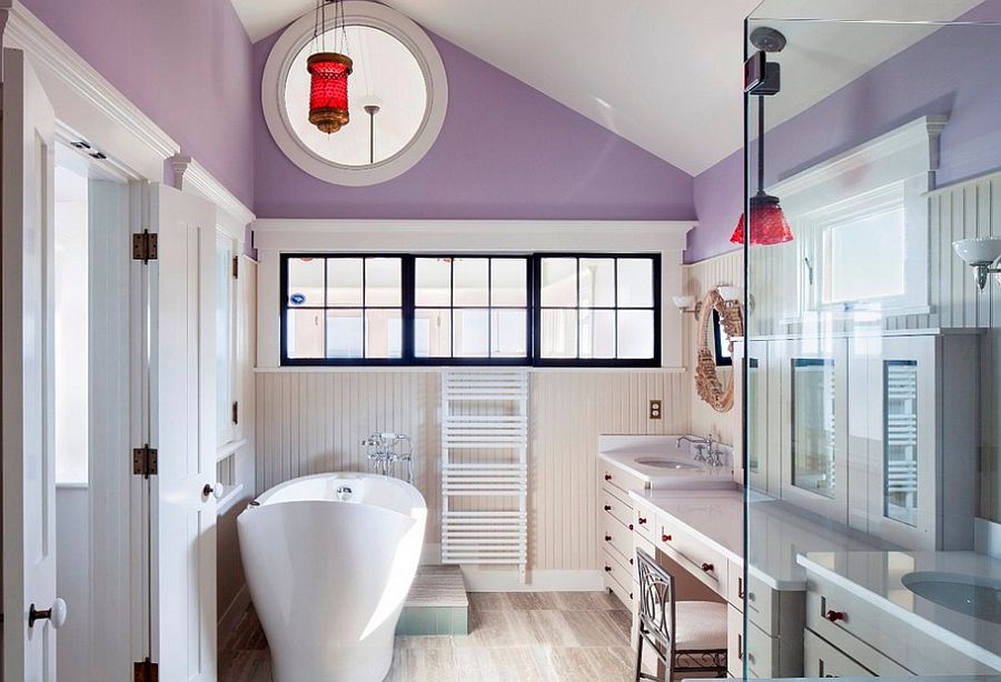 Luxurious purple bathroom with custom windows and beadboard accents