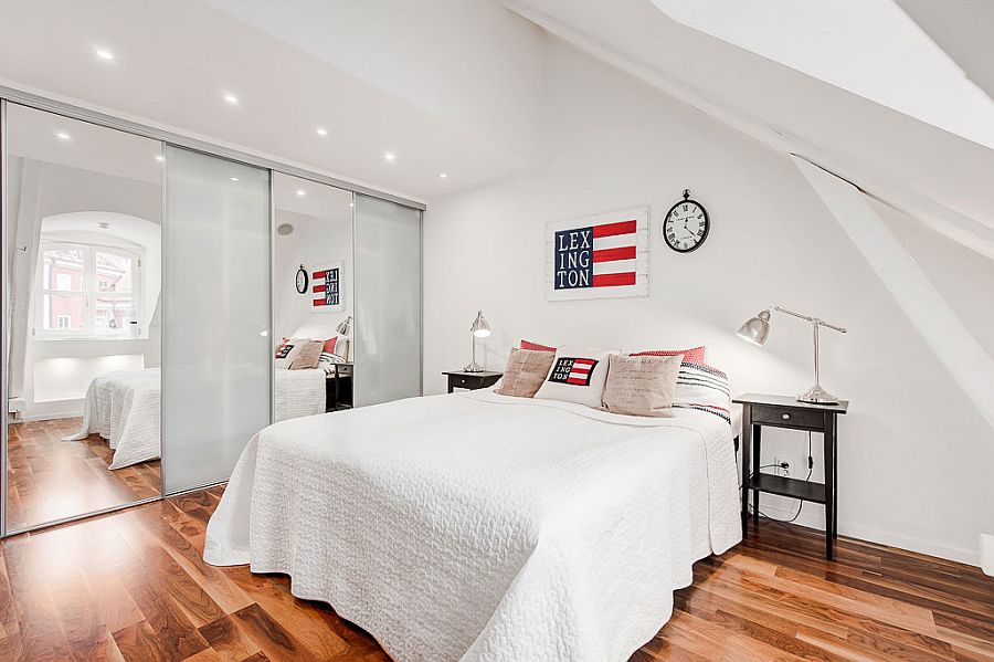 Mirrored and partitions visually enlarge the space in the bedroom