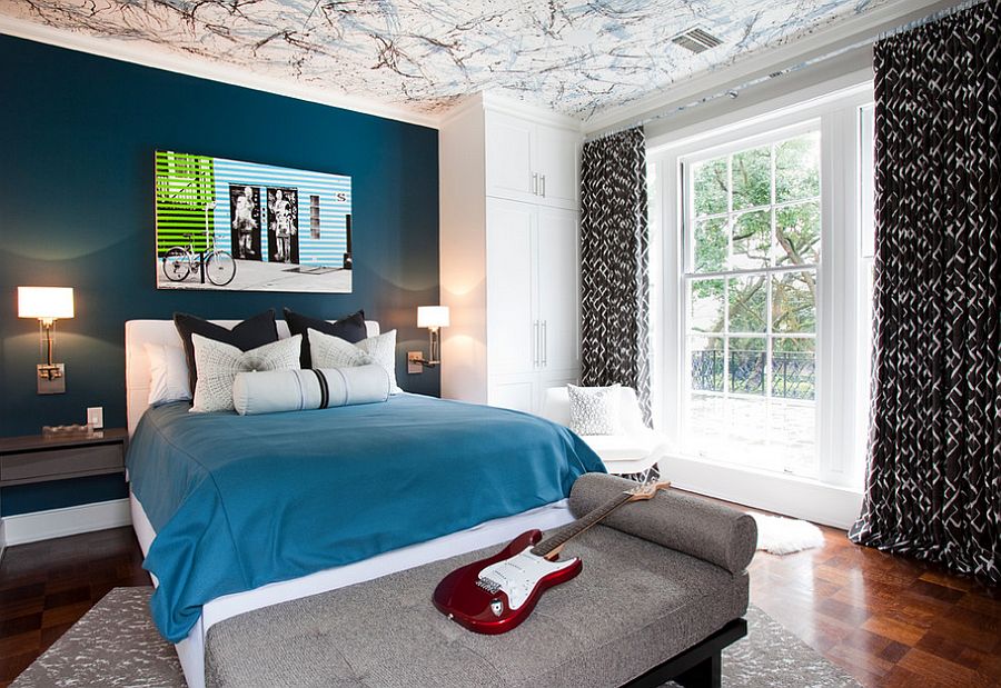 Posh boys' bedroom with a beautiful blue accent wall and creative ceiling [Design: Laura U / Photography by Julie Soefer]