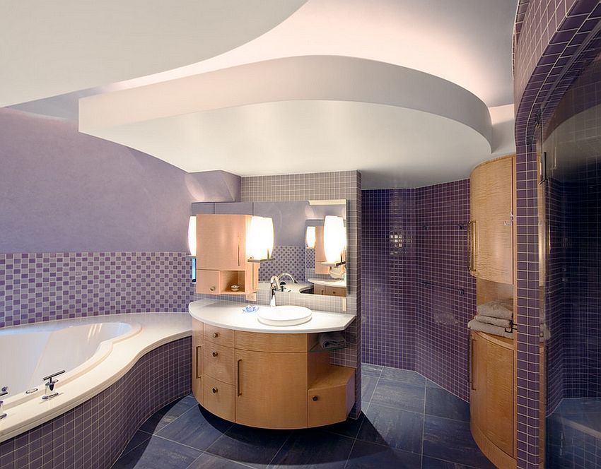 Sensational purple tiles and custom vanity shape the stunning bathroom