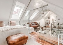 Sitting-area-and-bedroom-in-the-attic-seperated-by-glass-walls-217x155