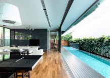 Sliding-glass-doors-connect-the-interior-with-the-courtyard-and-lap-pool-outside-217x155