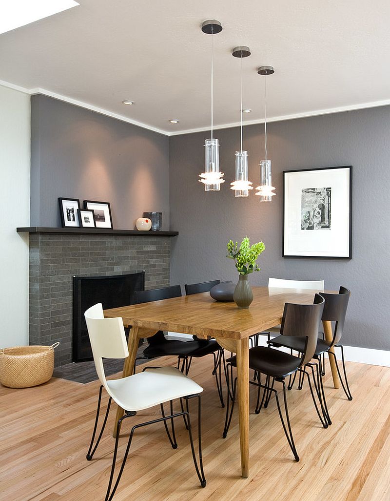 Stylish chairs and a gorgeous gray backdrop shape the contemporary dining room